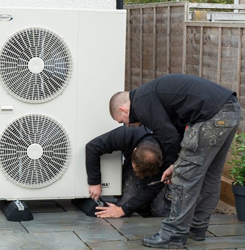 Professional heat pump installation team at work in Bowmanville, ON.